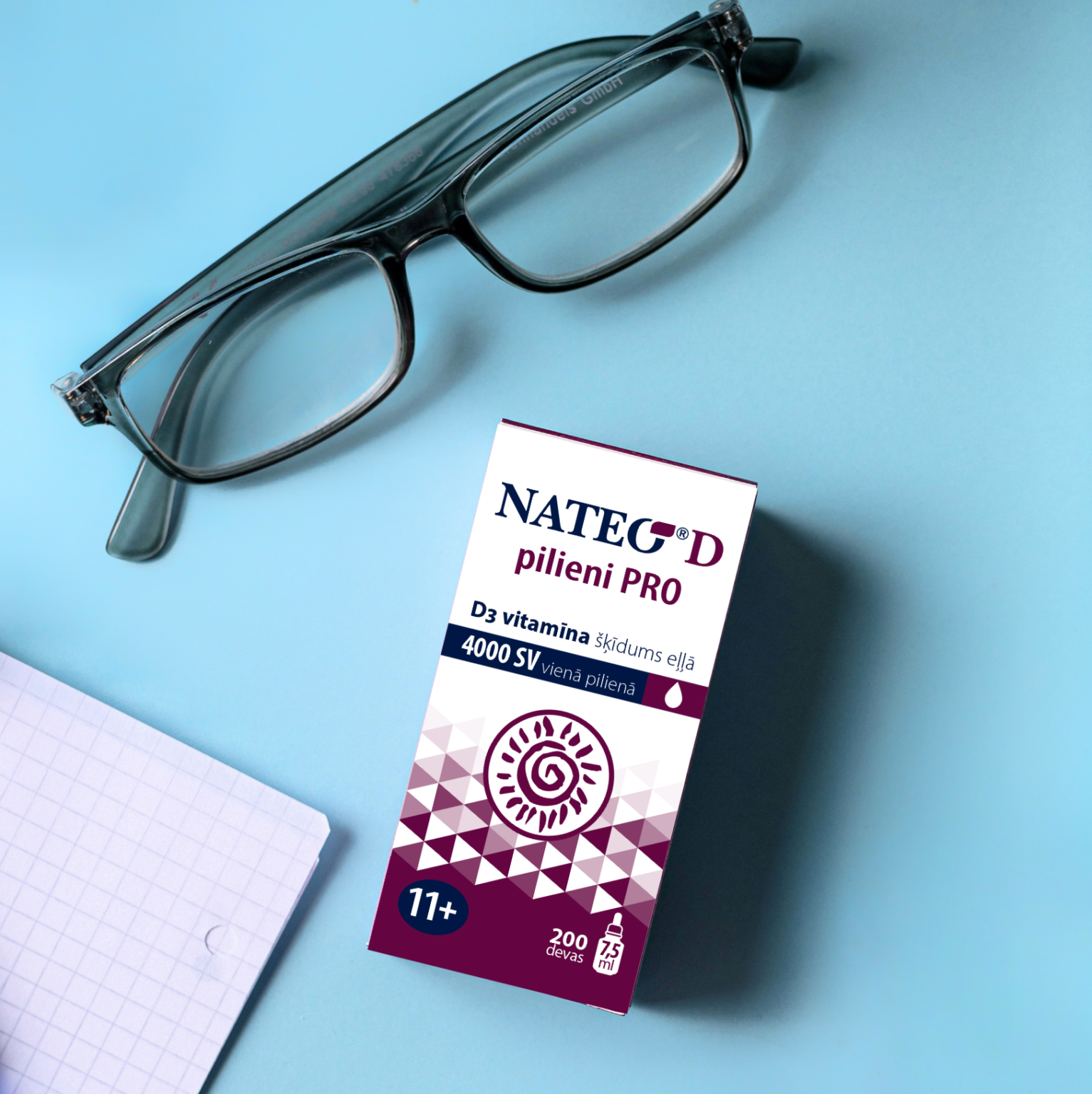 NATEO D Pro pilienu iepakojums uz gaiši zila fona